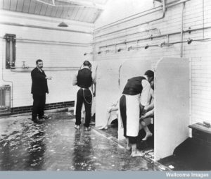 Male patients being washed by hospital orderlies. Credit: Wellcome Library, London. Wellcome Images images@wellcome.ac.uk http://wellcomeimages.org Male patients being washed by hospital orderlies, Long Grove Asylum, Epsom. In the Royal College of Psychiatrists. circa 1930? Published: - Copyrighted work available under Creative Commons by-nc 2.0 UK, see http://wellcomeimages.org/indexplus/page/Prices.html